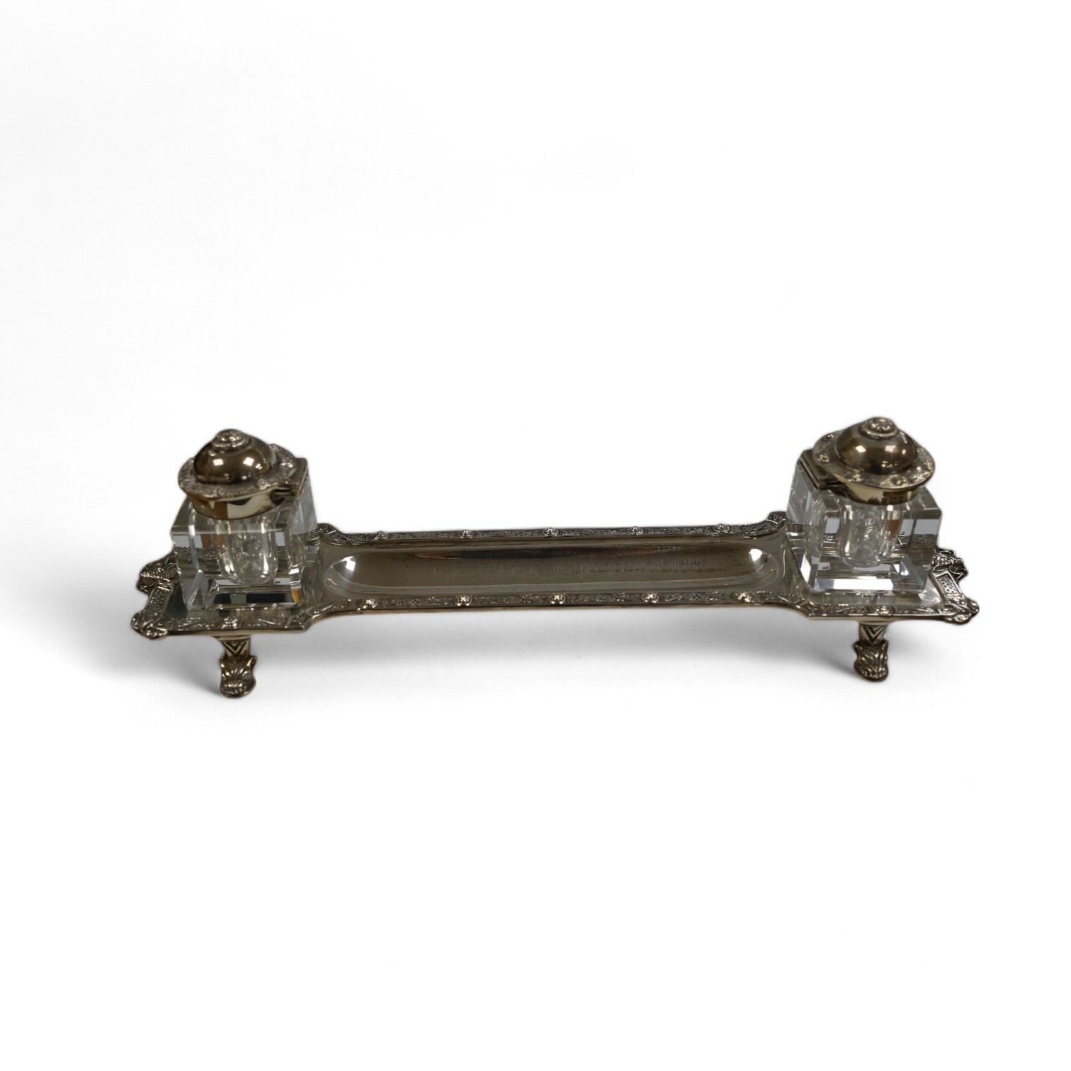 A modern silver inkstand with Celtic border and two mounted glass wells, Adie Bros. Birmingham, 1962, 26.3cm, 6.5oz. Condition - fair